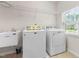 Convenient laundry room with a utility sink and ample natural light at 3504 Regent Pines Dr, New Hill, NC 27562