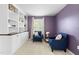 Office features built-in shelving and cabinets, and cozy seating for two at 3504 Regent Pines Dr, New Hill, NC 27562