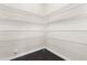 Well-organized pantry with metal shelving and dark wood flooring at 3504 Regent Pines Dr, New Hill, NC 27562