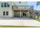 Covered patio with concrete flooring and stairs to the deck at 3504 Regent Pines Dr, New Hill, NC 27562