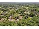 An aerial view of a neighborhood with mature trees and green lawns creating a serene and lush environment at 3606 Dairy Pond Pl, Durham, NC 27705
