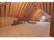 Unfinished attic space featuring exposed rafters and beams, offering potential for storage or customization at 3606 Dairy Pond Pl, Durham, NC 27705