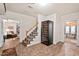 Basement entrance showing a staircase and a wine fridge. Next to a room with a ping pong table at 3606 Dairy Pond Pl, Durham, NC 27705