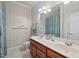 Bathroom featuring double sinks, toilet, tile flooring, and decorative wallpaper at 3606 Dairy Pond Pl, Durham, NC 27705