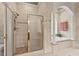 Full bath with shower and soaking tub at 3606 Dairy Pond Pl, Durham, NC 27705