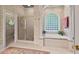 Elegant bathroom with a soaking tub and a separate glass shower at 3606 Dairy Pond Pl, Durham, NC 27705
