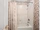 Bathroom featuring a shower/tub combo, and decorative wallpaper at 3606 Dairy Pond Pl, Durham, NC 27705