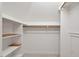 Walk-in closet with built-in shelving and rod for hanging clothes at 3606 Dairy Pond Pl, Durham, NC 27705