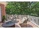 Covered patio boasts comfortable seating and a cozy ambiance for outdoor relaxation at 3606 Dairy Pond Pl, Durham, NC 27705