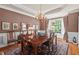 Formal dining room featuring hardwood floors, natural light, and a chandelier at 3606 Dairy Pond Pl, Durham, NC 27705