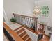 View of the foyer featuring a chandelier, hardwood floors, staircase, and beautiful arched window at 3606 Dairy Pond Pl, Durham, NC 27705