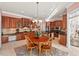 Large open kitchen features wood cabinets, granite countertops, stainless appliances, and a breakfast nook at 3606 Dairy Pond Pl, Durham, NC 27705