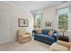 Cozy sitting room with plush seating, carpet, and natural light from windows, perfect for relaxing at 3606 Dairy Pond Pl, Durham, NC 27705