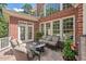 Outdoor patio with comfortable seating, a fire pit, and an exterior view of the backyard at 3606 Dairy Pond Pl, Durham, NC 27705