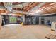Unfinished basement with exposed beams, black plastic sheathing, and potential for customization and storage at 3606 Dairy Pond Pl, Durham, NC 27705