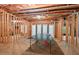 Spacious unfinished basement with a ping pong table and potential for future customization, expansion or storage at 3606 Dairy Pond Pl, Durham, NC 27705