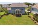 Expansive backyard with lush green lawn and screened porch, ideal for outdoor living at 408 Brierley Dr, Apex, NC 27523