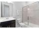 Bathroom features walk-in shower with glass door, tiled walls, and dark vanity at 408 Brierley Dr, Apex, NC 27523