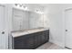 Bright bathroom features a double sink vanity and spacious mirror for a modern and functional space at 408 Brierley Dr, Apex, NC 27523