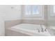 Bright bathroom features soaking tub for a modern and functional space at 408 Brierley Dr, Apex, NC 27523