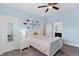 This bedroom features beautiful blue walls and lots of space for activities and play at 408 Brierley Dr, Apex, NC 27523