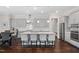 Modern kitchen with gray cabinets, stainless steel appliances, quartz countertops, and a spacious island at 408 Brierley Dr, Apex, NC 27523