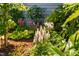 Eye-catching landscaping detail with a diverse collection of plants and flowers at 408 Brierley Dr, Apex, NC 27523