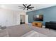 Modern living room featuring blue accent wall and sleek entertainment center, designed for comfort and style at 408 Brierley Dr, Apex, NC 27523