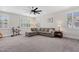 Inviting living room with a large sectional couch, plantation shutters and neutral colors, perfect for relaxing or entertaining at 408 Brierley Dr, Apex, NC 27523