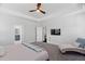 Bright main bedroom featuring a ceiling fan and ensuite bath for added convenience and modern living at 408 Brierley Dr, Apex, NC 27523