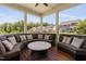 Covered patio with exterior walls and multiple couches overlooking the backyard at 408 Brierley Dr, Apex, NC 27523
