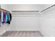 Spacious walk-in closet with ample storage racks and well-lit interiors, offering plenty of organization space at 408 Brierley Dr, Apex, NC 27523