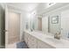 Spacious bathroom features double sinks, ample storage, and a large mirror at 4309 Omni Pl, Raleigh, NC 27613