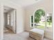 Cozy bedroom nook featuring a sunlit window with cushioned ottoman at 4309 Omni Pl, Raleigh, NC 27613