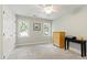 Neutral bedroom with bright window, closet, and a ceiling fan at 4309 Omni Pl, Raleigh, NC 27613