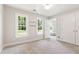 Bedroom with neutral walls, carpet, and built in shelving and closet at 4309 Omni Pl, Raleigh, NC 27613