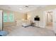 Open bonus room area with seating, TV, and lots of natural light at 4309 Omni Pl, Raleigh, NC 27613