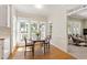 Sun-filled breakfast nook with hardwood floors and large windows at 4309 Omni Pl, Raleigh, NC 27613