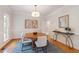 Dining room with hardwood floors, area rug, round table, and elegant decor at 4309 Omni Pl, Raleigh, NC 27613
