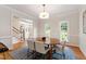 Bright dining area featuring wood floors, natural light, and elegant trim details at 4309 Omni Pl, Raleigh, NC 27613
