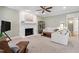 Bright living space with fireplace, neutral tones, and comfortable seating arrangement at 4309 Omni Pl, Raleigh, NC 27613