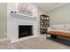 Elegant living room with fireplace, built-in shelving, and stylish decor at 4309 Omni Pl, Raleigh, NC 27613