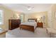 Main bedroom with a ceiling fan, carpet, and ample natural light at 4309 Omni Pl, Raleigh, NC 27613