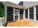 The rear porch is screened in and leads to an exterior deck at 4309 Omni Pl, Raleigh, NC 27613