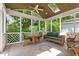Relaxing screened-in porch with ceiling fan and outdoor seating at 4309 Omni Pl, Raleigh, NC 27613