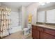 Clean bathroom with vanity, granite countertop and shower-tub combo at 437 Excalibur Dr, Morrisville, NC 27560