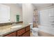 Bathroom with single vanity and tub shower combo with tile flooring at 437 Excalibur Dr, Morrisville, NC 27560