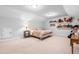 Bedroom featuring carpet, ceiling fan, and teddy bear shelves at 437 Excalibur Dr, Morrisville, NC 27560