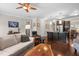 Inviting living area with open floor plan, hardwood flooring, and view into modern kitchen at 437 Excalibur Dr, Morrisville, NC 27560