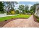 Well-maintained backyard with a stamped concrete patio and lush green lawn at 4412 Pamlico Dr, Raleigh, NC 27609